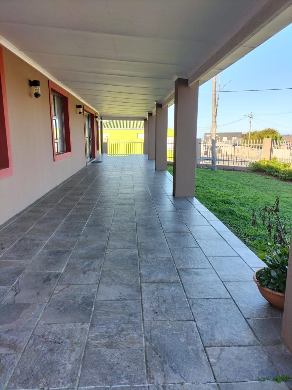 Covered veranda walkway at Harbour Haven Guesthouse in Mossel Bay